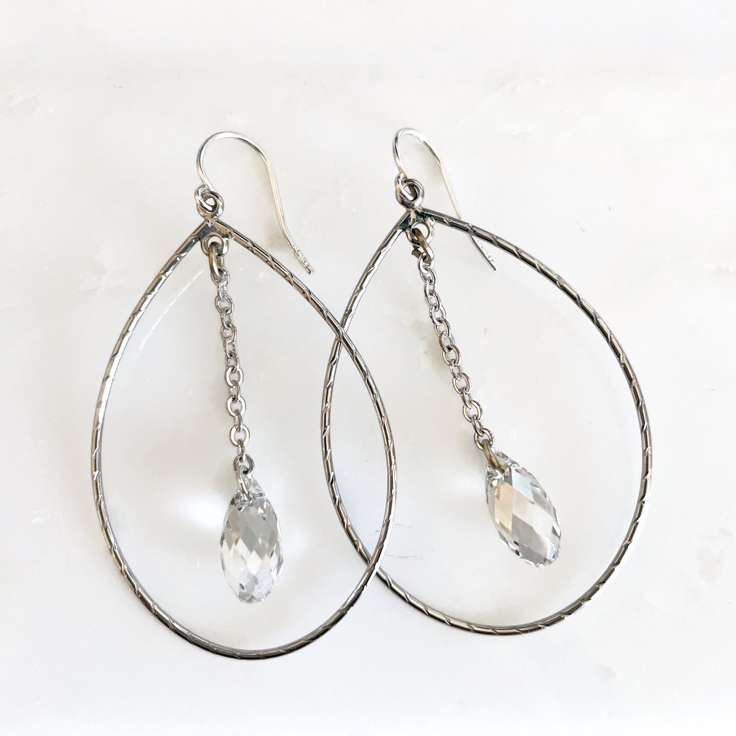 Teardrop hoop earrings with teardrop crystals