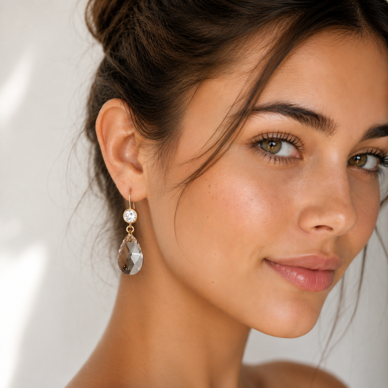 Clear crystal dangle earrings on matte gold
