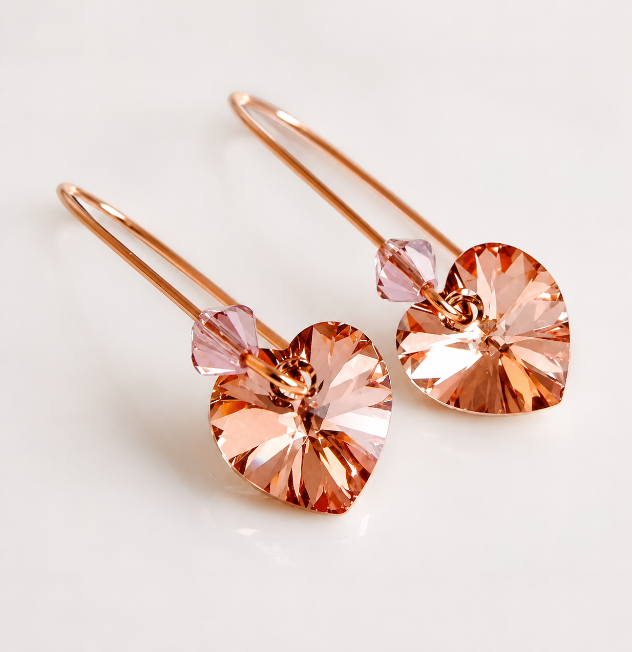 Blush crystal heart earrings in rose gold
