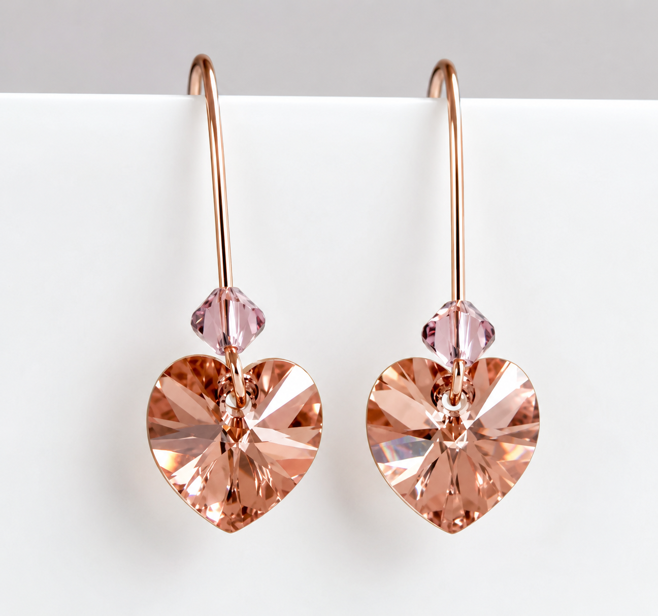 Blush crystal heart earrings in rose gold