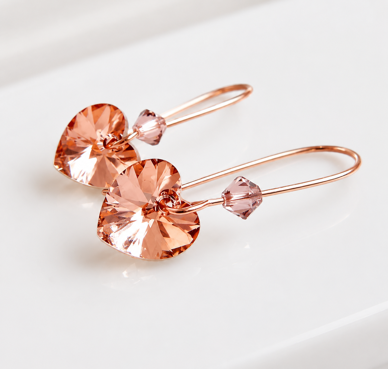 Blush crystal heart earrings in rose gold