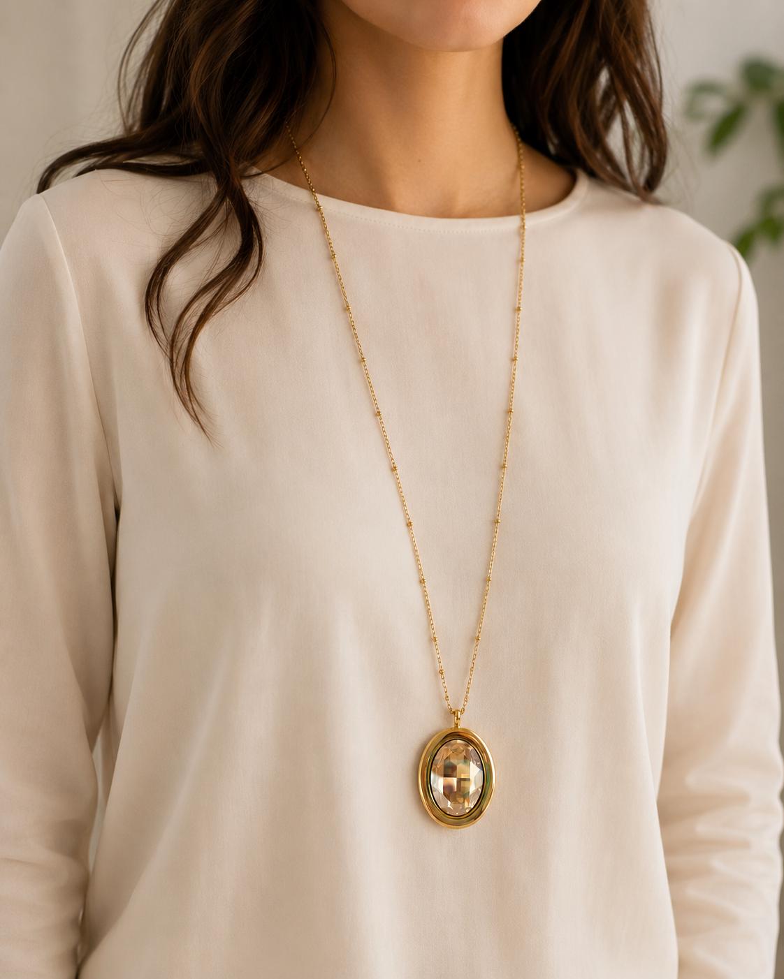 Large gold oval crystal pendant