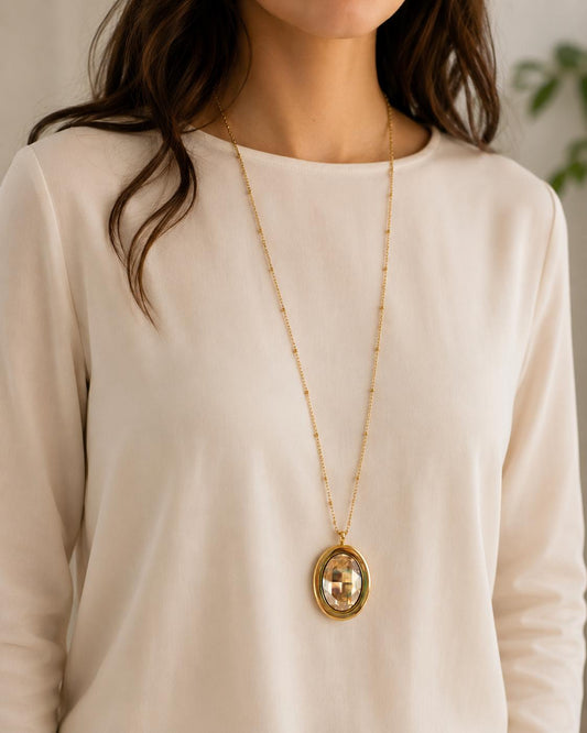 Large gold oval crystal pendant