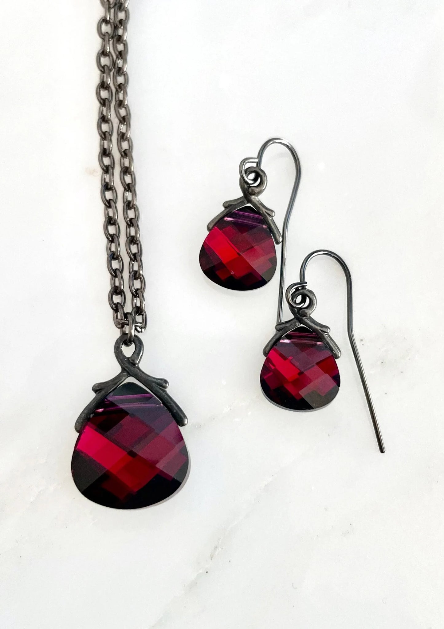 Ruby red Swarovski Crystal Flat Briolette earrings on gunmetal