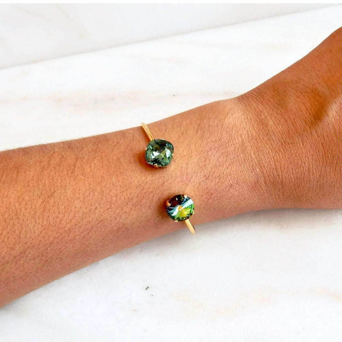 Gold open cuff bracelet in green crystal