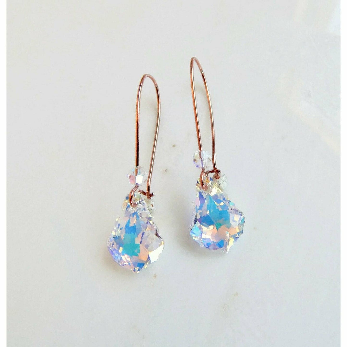 Iridescent crystal earrings on rose gold