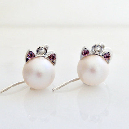 White pearl cat earrings