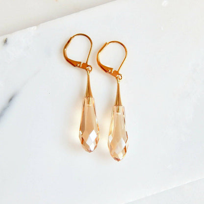 Golden teardrop capped crystal