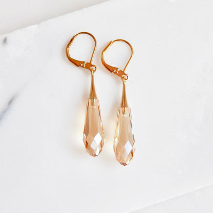 Golden teardrop capped crystal