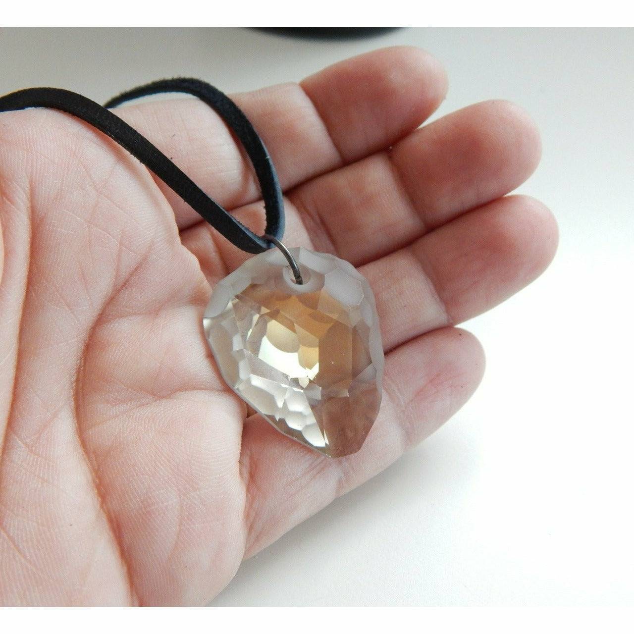 Rock crystal pendant on black leather necklace
