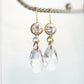Clear crystal dangle earrings on matte gold