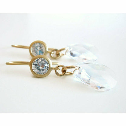 Clear crystal dangle earrings on matte gold