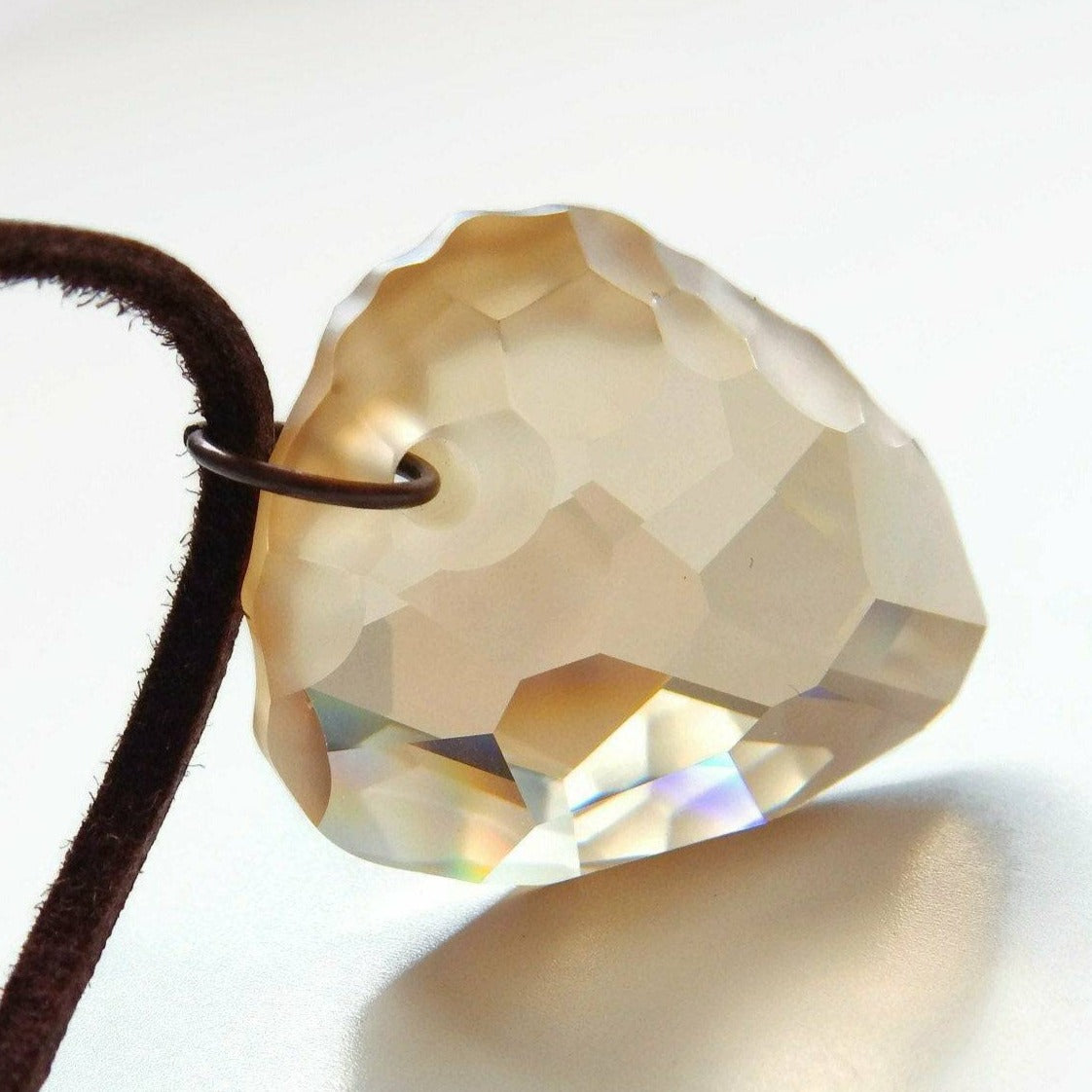 Golden rock crystal pendant on leather necklace